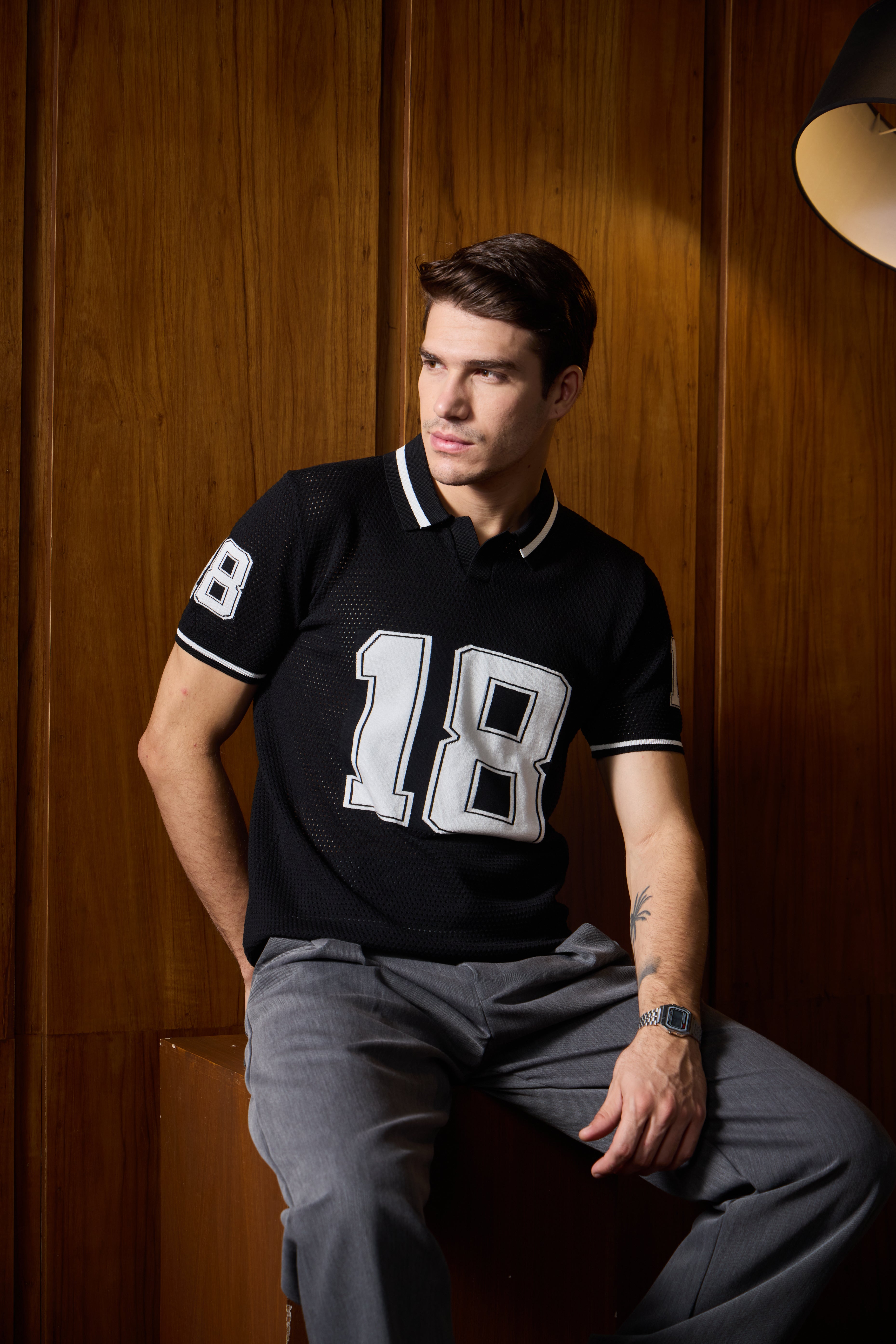 THE VARSITY MESH POLO IN DEEP BLACK