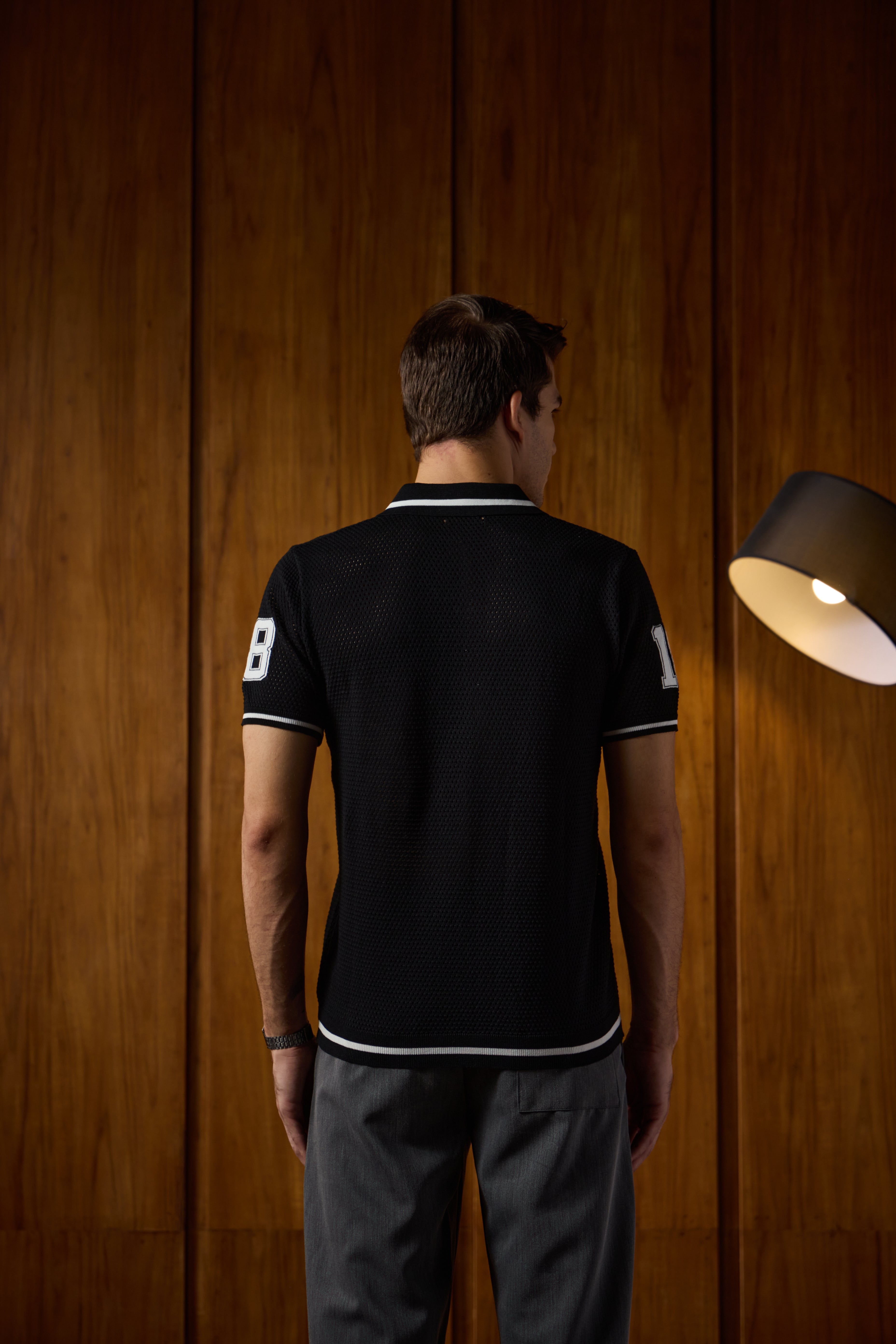 THE VARSITY MESH POLO IN DEEP BLACK