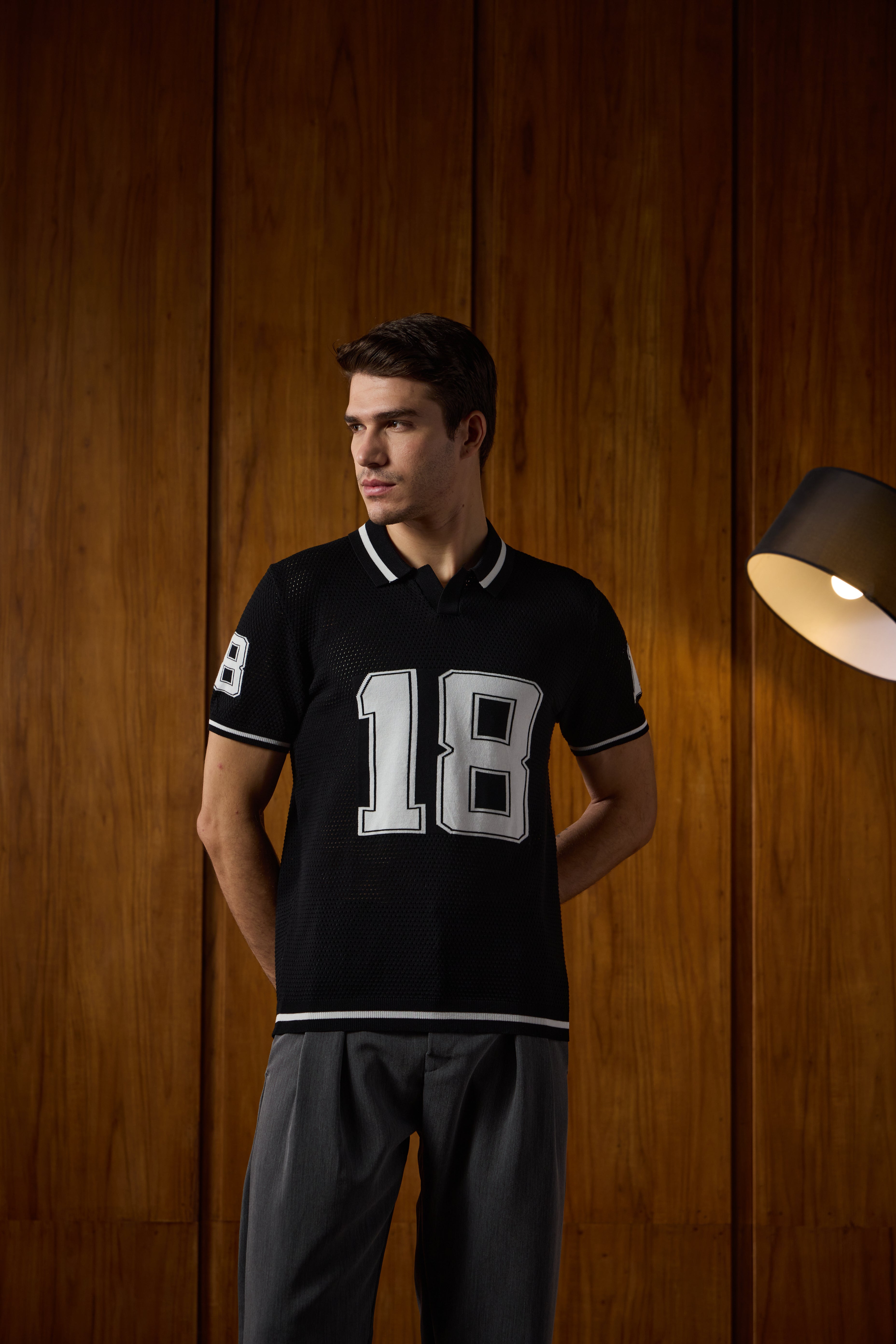 THE VARSITY MESH POLO IN DEEP BLACK