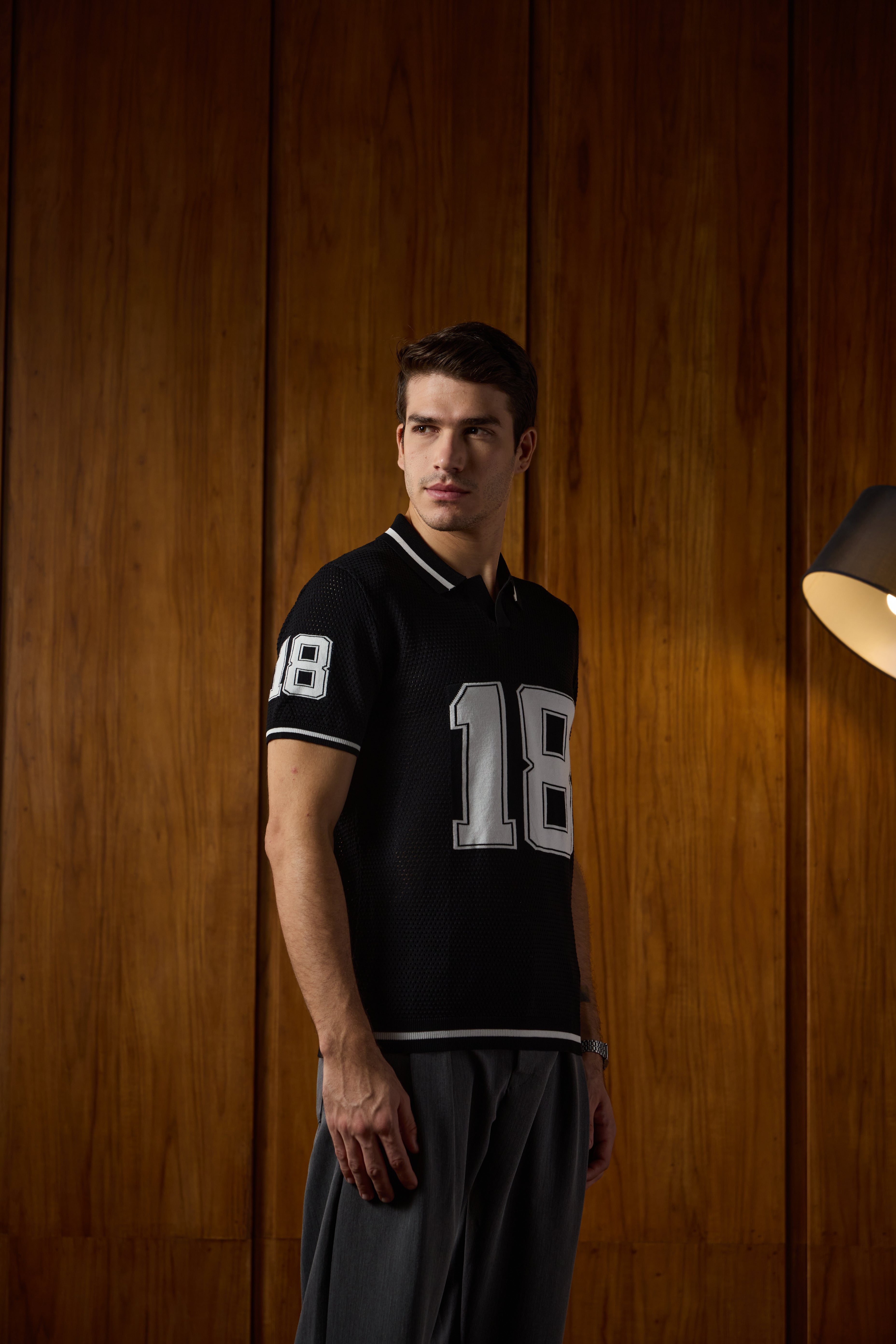 THE VARSITY MESH POLO IN DEEP BLACK