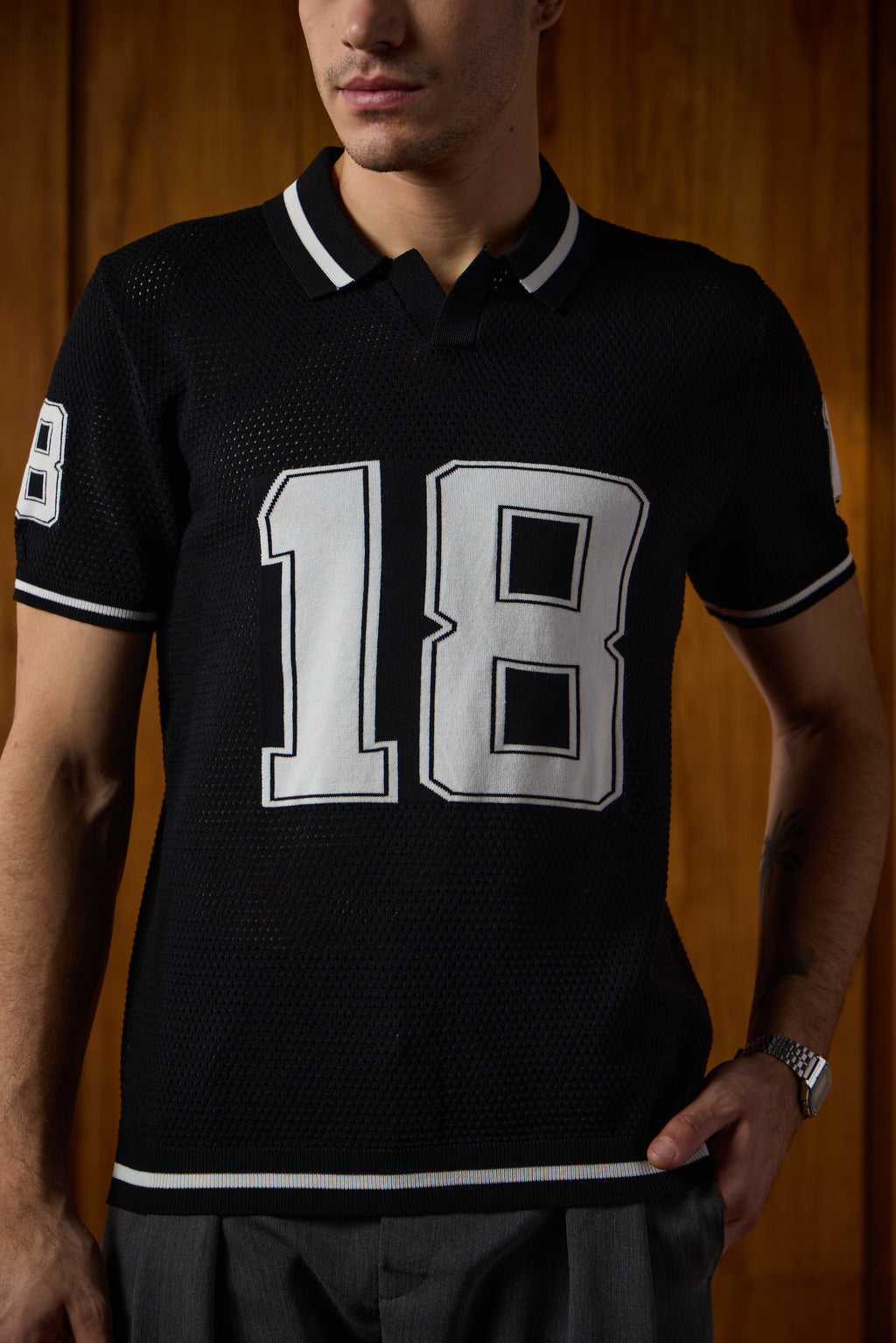 THE VARSITY MESH POLO IN DEEP BLACK